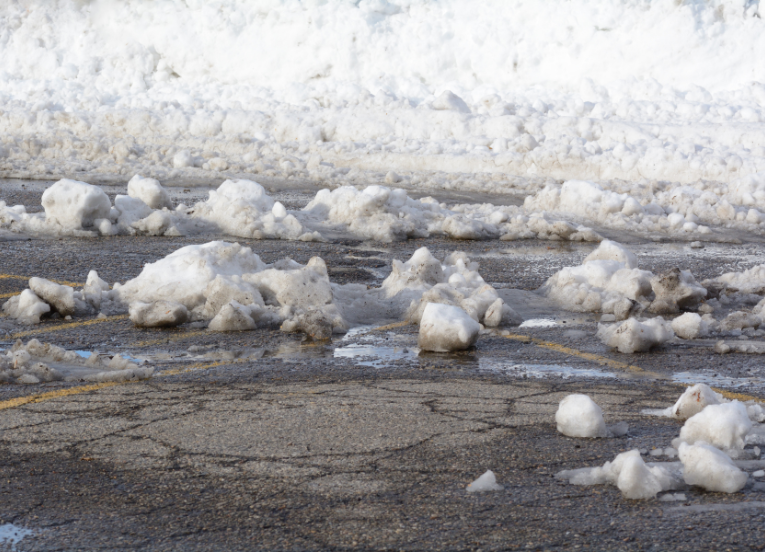 snow and ice in a Bergen apartment complex parking lot